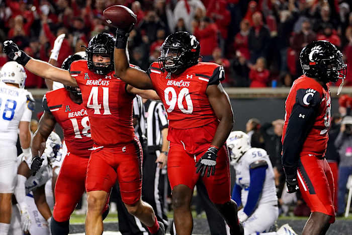 Cincinnati Bearcats defensive lineman Jabari Taylor (90)(90) celebrates after recovering a fumble in the end zone in the fourth quarter during an NCAA football game against the Tulsa Golden Hurricane, Saturday, Nov. 6, 2021, at Nippert Stadium in Cincinnati. The Cincinnati Bearcats won, 28-20. Tulsa Golden Hurricane At Cincinnati Bearcats Nov 6